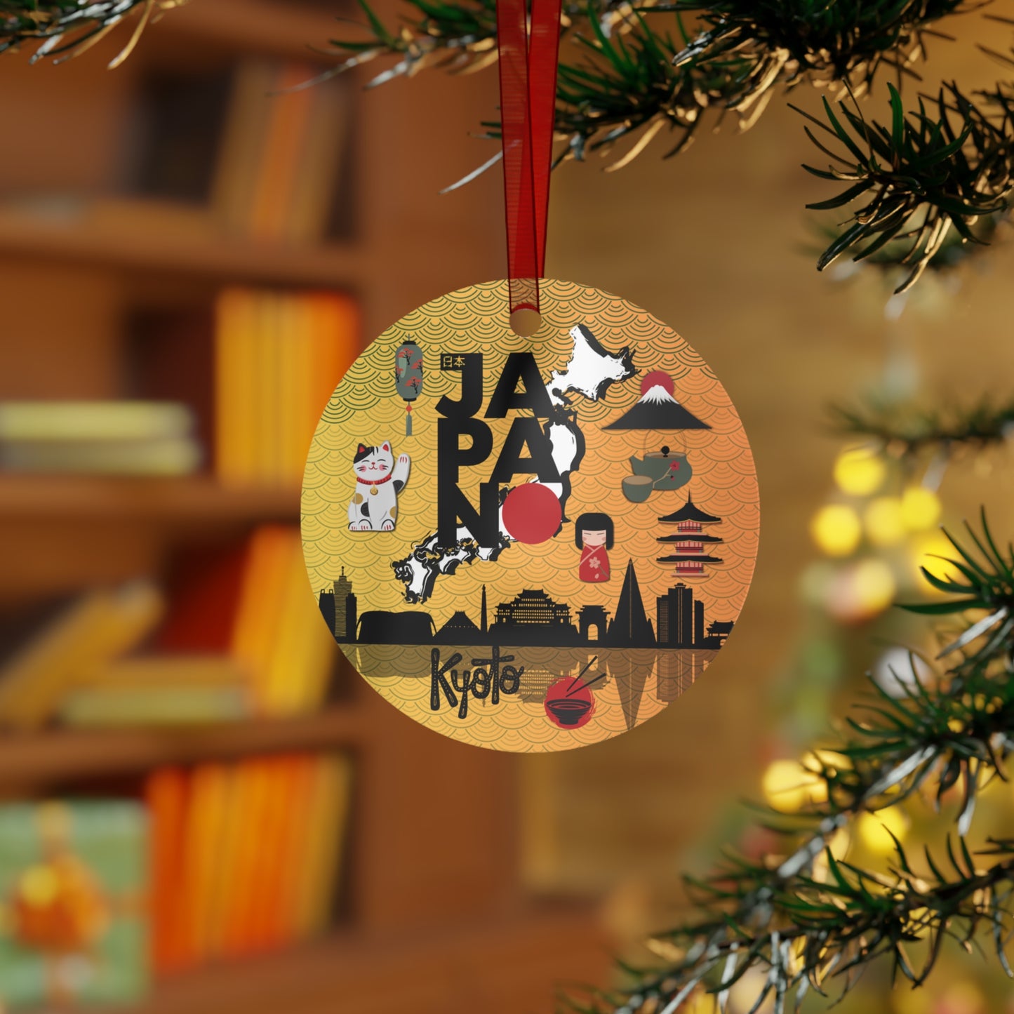 Decorative ornament with Japanese-themed illustrations hanging on a tree branch.