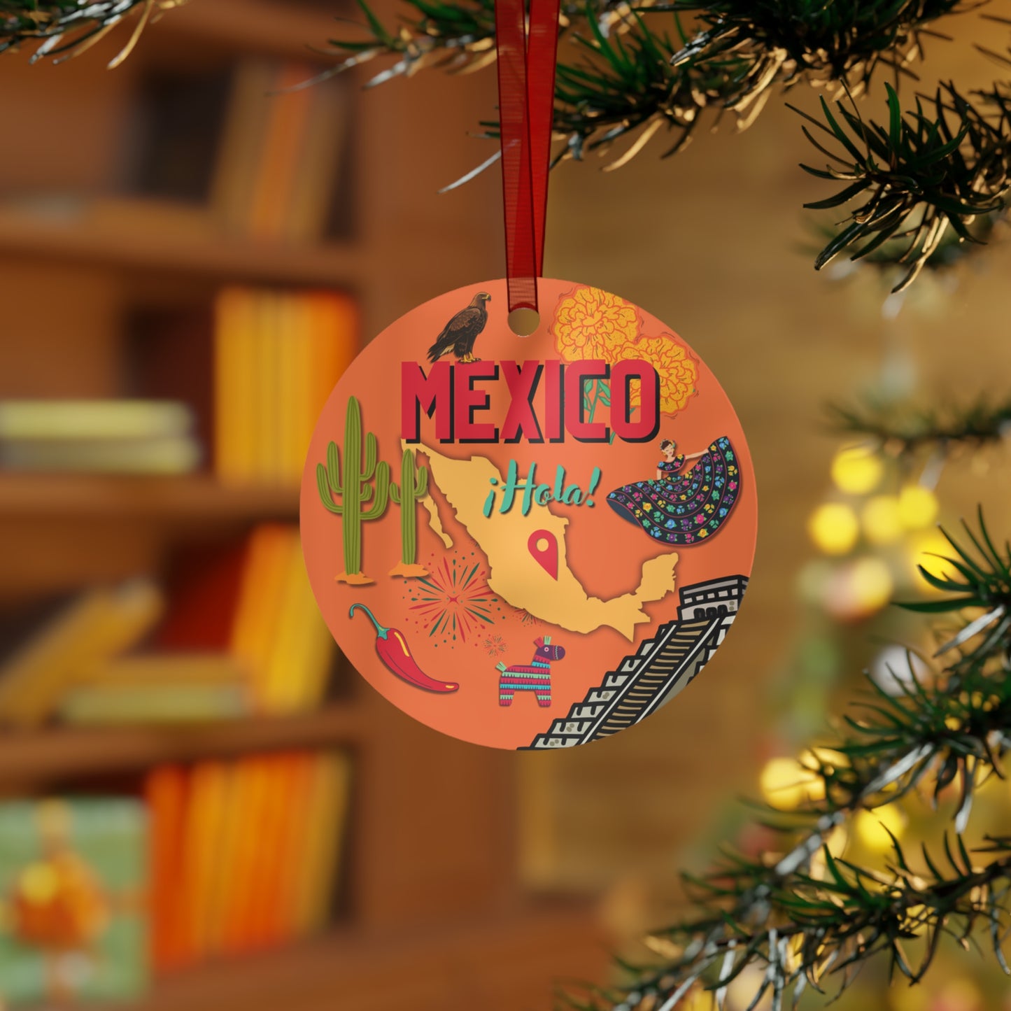 Decorative ornament with 'MEXICO ¡Hola!' text hanging on a tree branch.