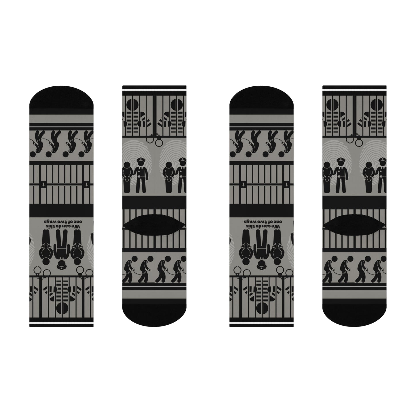 A pair of black and white crew socks with a geometric pattern, featuring designs that include cubes and what appears to be a representation of a police station or jail.