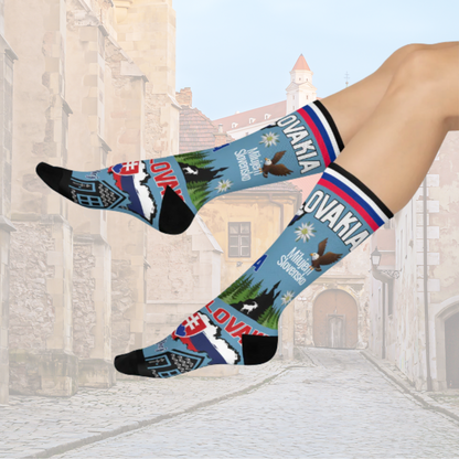 Colorful socks with Slovakian designs worn by a person in an architectural setting.