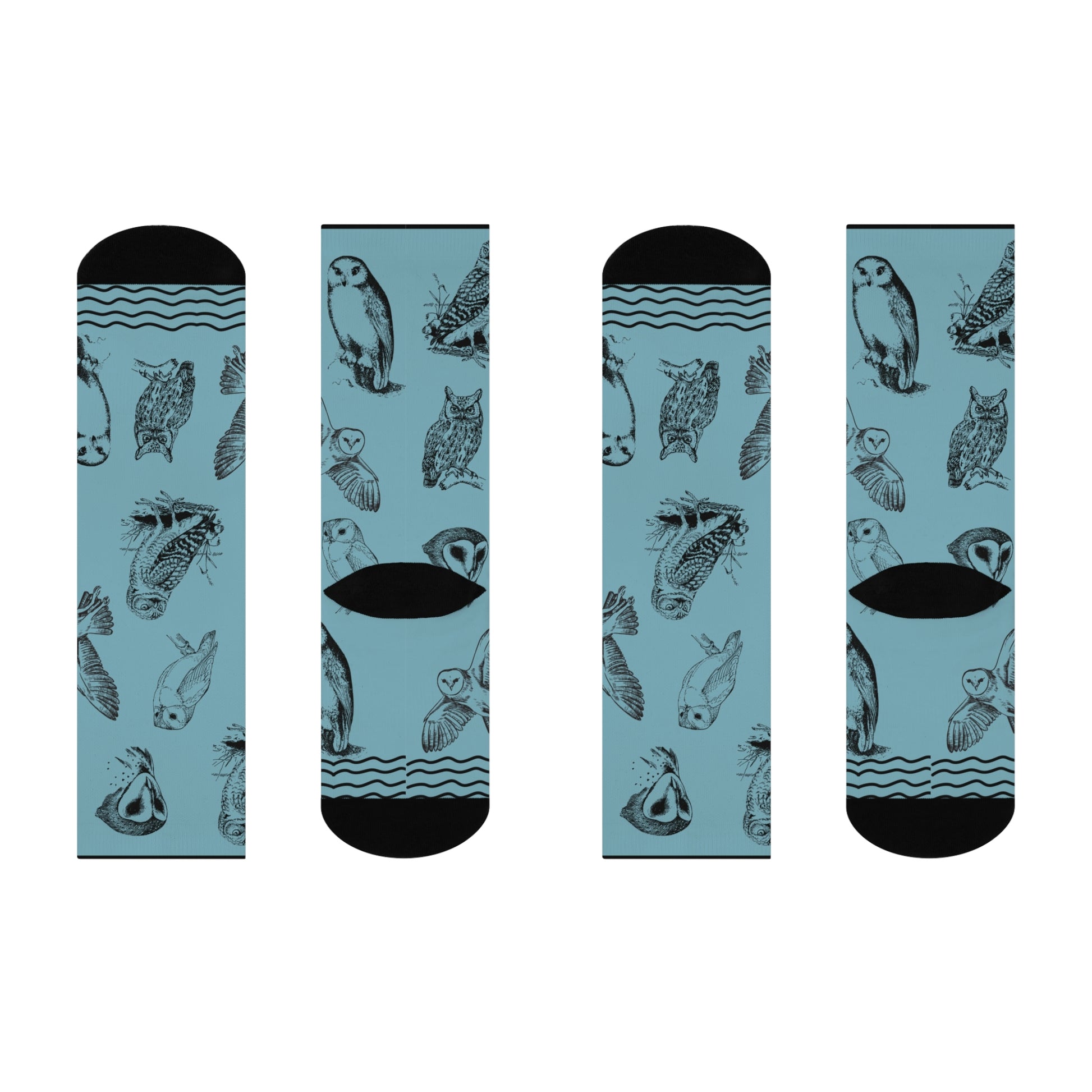 A pair of blue socks with owl patterns, designed for mid-calf coverage.
